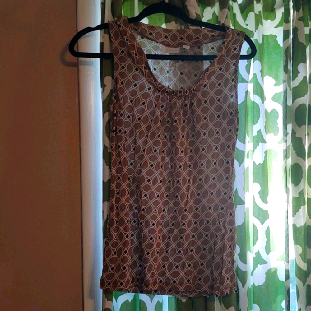 Patterned top. Nice for layering in Fall. Can be dressed up or down. Like New